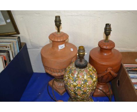 Two pottery urn style table lamps together with a floral decorated papier mache lamp (3)