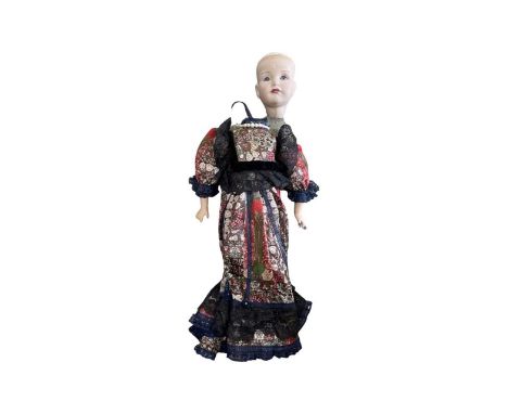 A Kammer and Reindhart bisque head doll, lacking hair and requiring repair. Marker to back of head K&amp;R - 114Length approx
