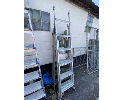 Two aluminium folding step ladders together with a wooden step ladder