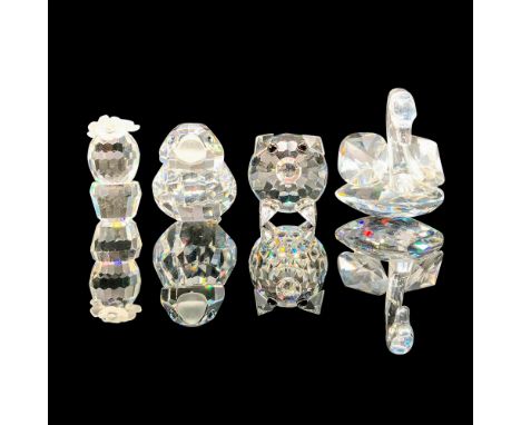 A set of four clear crystal figures, three depicting animals, and one depicting a cactus with fogged crystal flowers. The fou