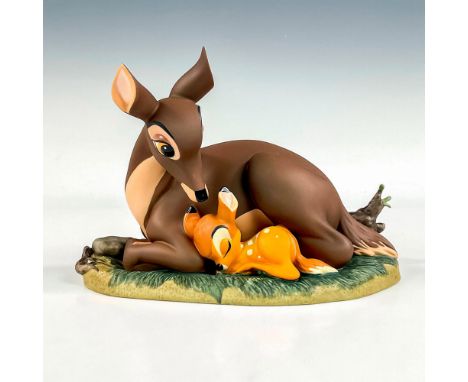 Porcelain figure with matte finish. From the 1942 animated film, Bambi, depicts Bambi with his mother. Includes a silver tone