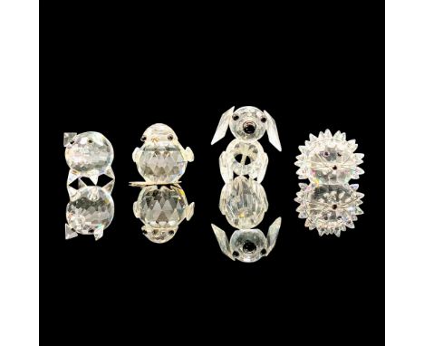A set of four clear crystal figurines depicting various animals with black crystal for the eyes. The figures are, Mini Pig 01