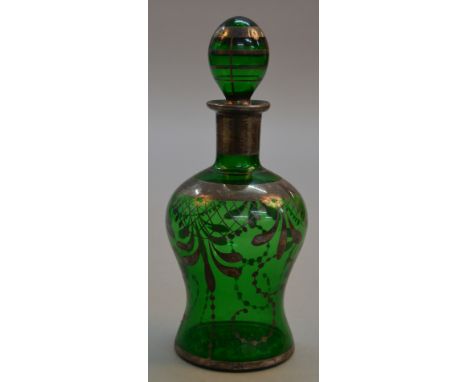 A vintage Italian glass decanter with silver overlay
