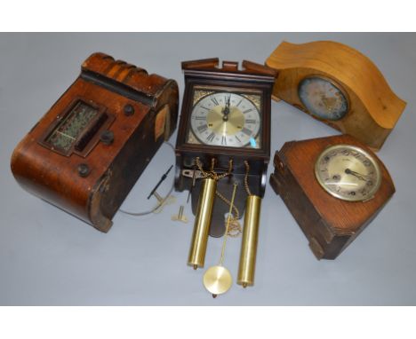 An early 20th century valve radio (}back panel missing) together with2 mantle clocks and a wall hanging example (4)