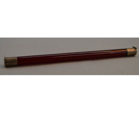 A ruby glass writing rest with hallmarked silver terminals. 31cm long.