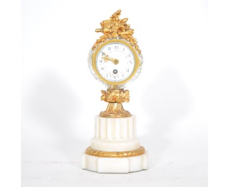 French mantel clock, column form, cut glass (repaired), ormolu and marble case,, circular enamelled dial (restored), 23cm.
