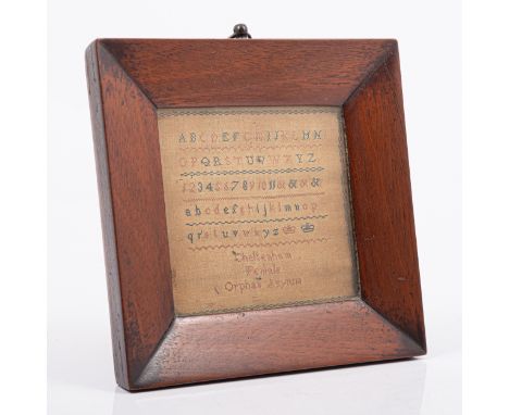 A small Victorian alphabet sampler, Cheltenham Female Orphan Asylum, 9 x 9cm, mahogany frame 14.5cm x 14.5cm.Footnote: Founde