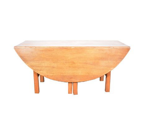Arts &amp; Crafts oak dining table, probably by Neville Neal, oval top with two drop leaves, chamfered gate legs with two pla