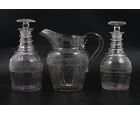 A Regency cut glass mallet-shaped decanter, quadruple ringed neck, with an engraved band, fluted mushroom stopper, 24cm; anot