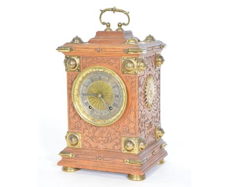 Victorian oak table clock, the case with carved panels and gilt brass mounts, circular dial with silvered chapter ring, Roman