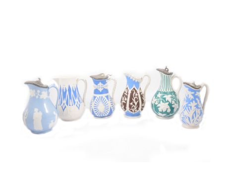 A white stoneware and blue painted Arches &amp; Scrolls jug, W H Copeland, 20cm: off-white stoneware blue and brown painted G