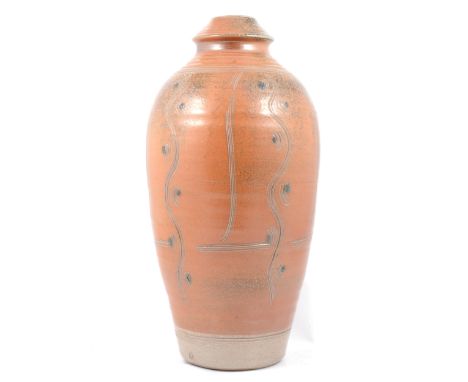 Ray Finch for Winchcombe Pottery, a stoneware bottle vase, iron glaze incised with wave and dot design, impressed WP mark, 45