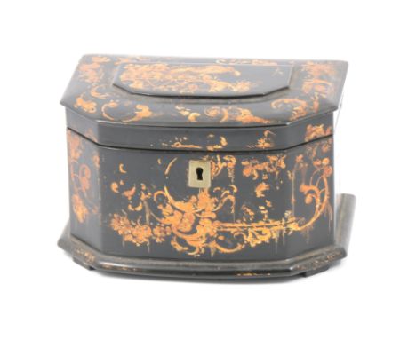 An early Victorian black lacquered papier-mache tea caddy, in the manner of Jennens and Bettridge, shaped front, painted gilt