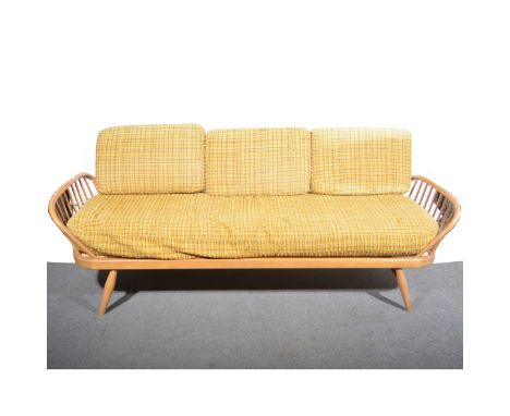 An Ercol elm and beech Studio Couch, Model 355, loose cushions, length 208cm, depth approximately 75cm, height 76cm.