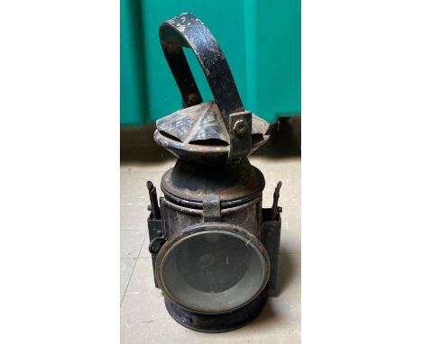 A WWII period railway three aspect hand held lamp with original burner, makers plate for Eastgate &amp; Son dated 1943 with m