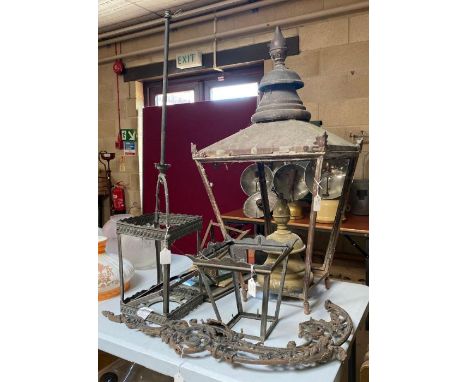 A Victorian copper frame for a street gas light approximately 91cms high; some associated glass panels; two other lantern fra