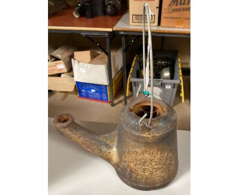 A Wells cast iron oil lamp with carrying handle, used by the railways, height of lamp 17cms high **Lots must be paid for and 