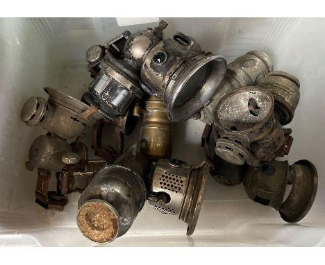 A Powell and Hanmer carbide bicycle lamp approximately 19cms high; another by Lucas and other carbide lamps and parts **Lots 