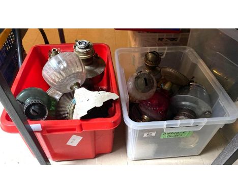 A quantity of assorted oil lamp bases including some coloured glass **Lots must be paid for and collected within seven workin