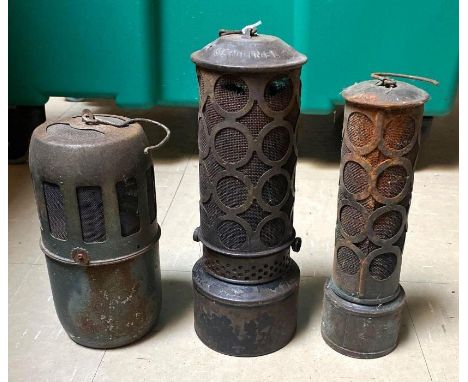 An early 20th century Sentinel oil automobile engine heater with suspension loop, 27cms high together with two others **Lots 