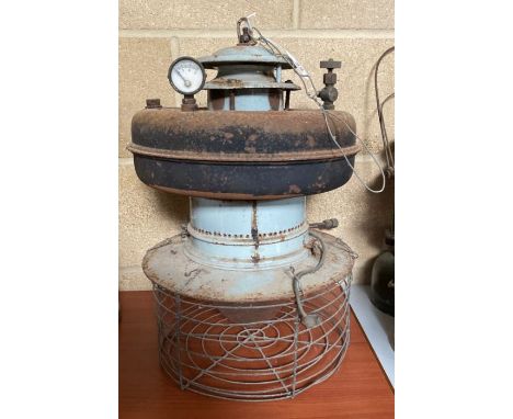 An oil fired suspension lamp having grey painted metal centre, black painted metal reservoir with gauge, original glass shade