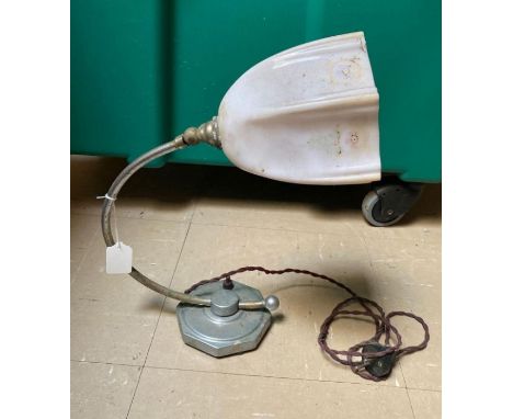 An early 20th century electric wall light with chromed arm, adjustable head and original glass shade **Lots must be paid for 