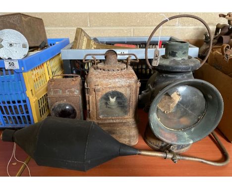 A Lucas car lamp with carrying handle, 35cms high including handle; a small rear lamp possibly for a car (lacks burner); a ha