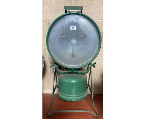 A Tilley floodlight projector lamp "Tilley Hendon" having green painted casing and base, thick clear glass panels etched "Til