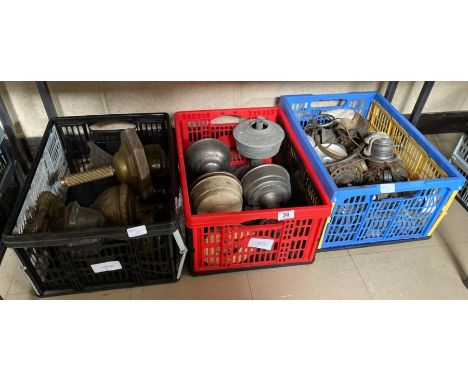 A quantity of oil lamp parts, bases, some in decorative brass **Lots must be paid for and collected within seven working days