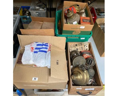 A quantity of oil and gas lamp parts, wicks, boxed Aladdin Wicks, oil lamp bases, etc **Lots must be paid for and collected w