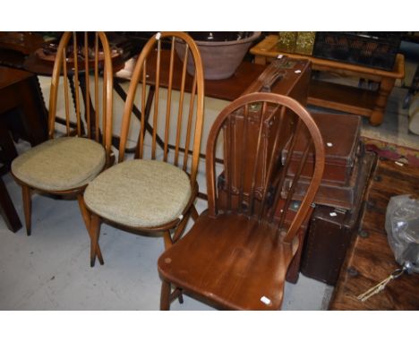 A traditional Ercol kitchen and a pair of similar hoop and stick back high back kitchen chairs