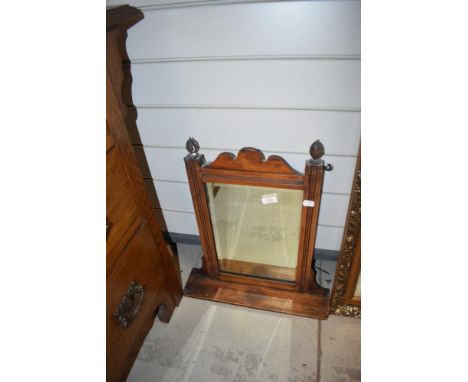 A Victorian stained frame wall mirror with shelf