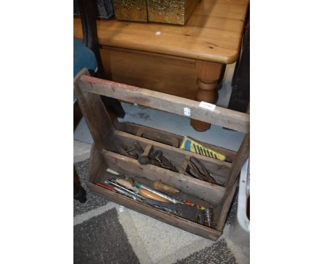 A wooden tool trug and contents