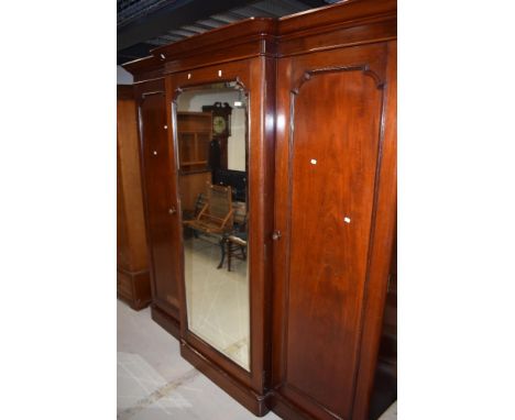 Victorian three section wardrobe having mahogany case with mirror door