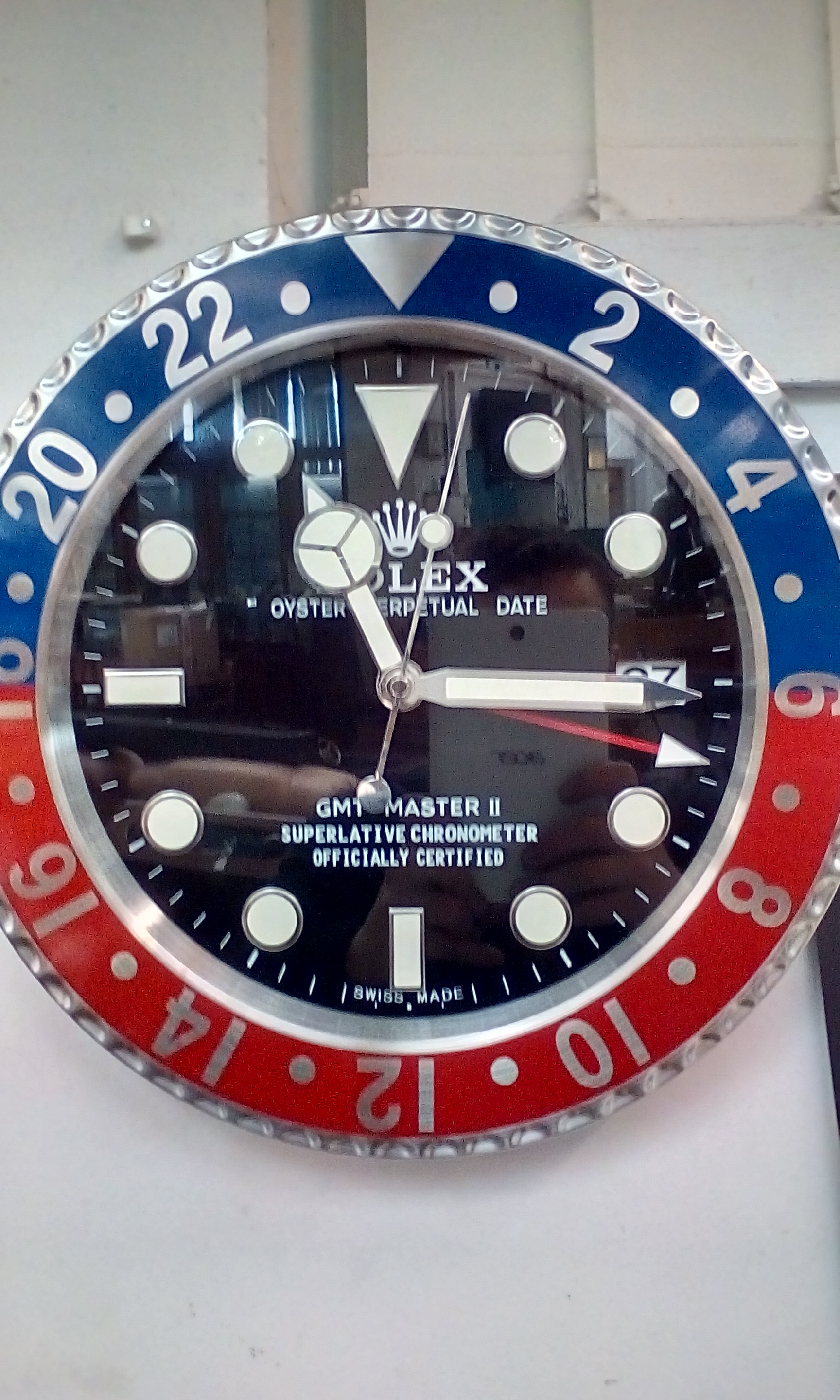 Rolex Oyster perpetual date GMT/Master II Superlative Chronometer. Rolex dealers wall clock
