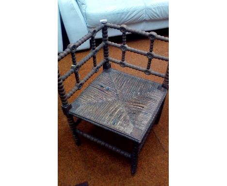 Early bobbin turned and rush seated corner chair