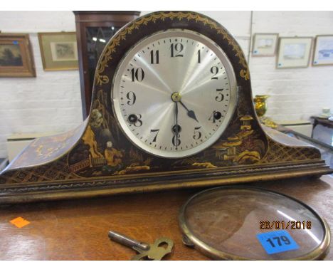 An early 20th century Japanned mantle clock with key