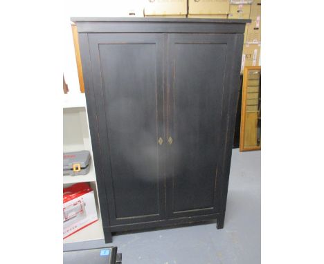 A modern Italian black painted cabinet with twin doors enclosing a slide and shelf, 69h x 44w