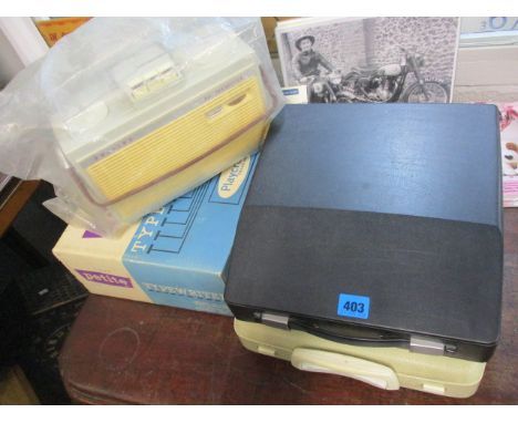 A child's Petit typewriter and two other typewriters, together with a Philips tape recorder