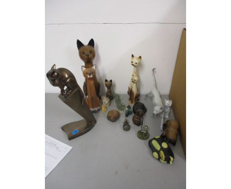 Model cats to include an Art Deco style bronzed plaster example, carved wood, metal and ceramic examples
