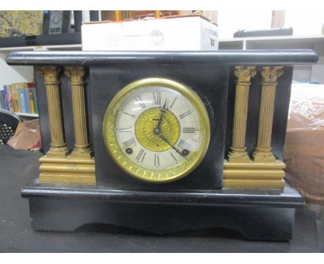 A Victorian black painted, pine cased mantle clock, 10 3/4 h x 15 3/4 w