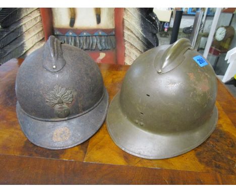 A WW1 M15 Adrian French army helmet, black painted , comb finial attached to crown by four pins, six finger leather lining pu