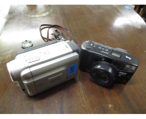 A cased Nikon 100M 700VR camera, a Panasonic NVD55 digital video camera and a photographic tripod