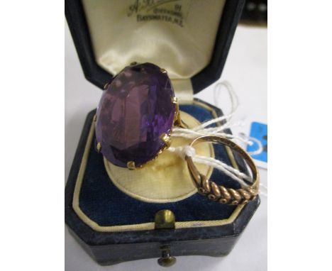 A large oval amethyst and 9ct yellow gold ring and a 9ct rose gold ring bearing a wheat sheaf design, A/F