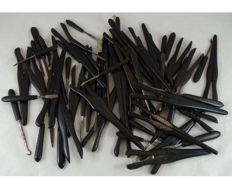 Large quantity of ebony button hooks, glove stretchers & manicure tools  