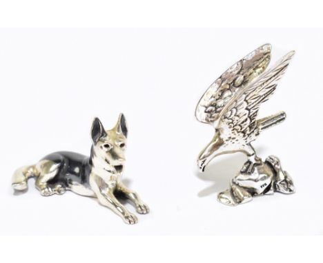 SATURNO; an Italian 800 grade silver and enamelled model German shepherd, length 4.3cm, and an eagle on rocky out crop stampe