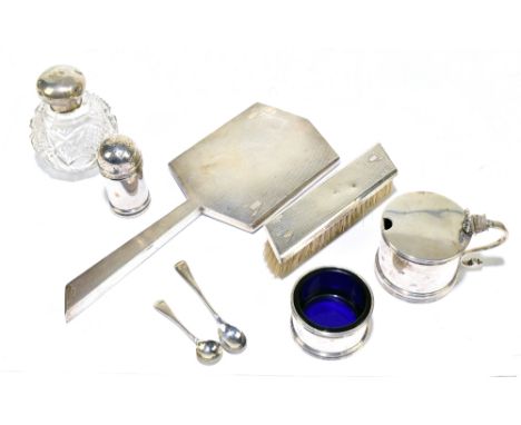 STOKES &amp; IRELAND LTD; a George V hallmarked silver three-piece condiment set comprising lidded mustard (lacking liner), o