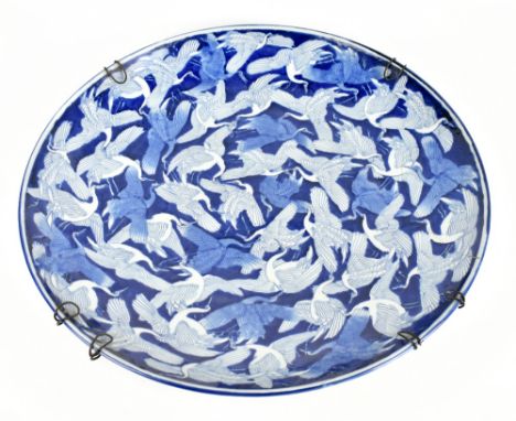 A large late 19th century Chinese porcelain blue and white charger, decorated throughout with cranes, six character mark to t