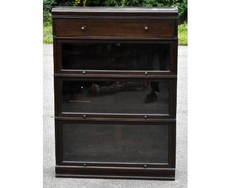 MEOVOTO; an early 20th century stained oak Globe Wernicke style bookcase with drawer above three glazed sections, height 122c