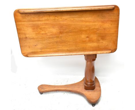 A Victorian mahogany adjustable reading table, with turned column on shaped base, height when closed approx 55cm, width 83.5c